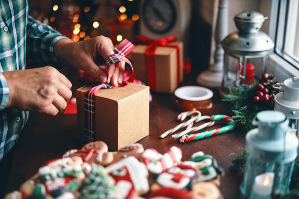 istock Wrapping and Decorating Christmas Presents in a Home Atmosphere 1426294991