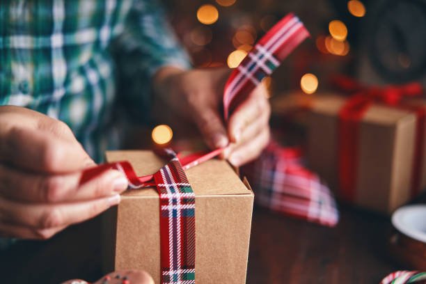 istock Wrapping and Decorating Christmas Presents in a Home Atmosphere 1426295059