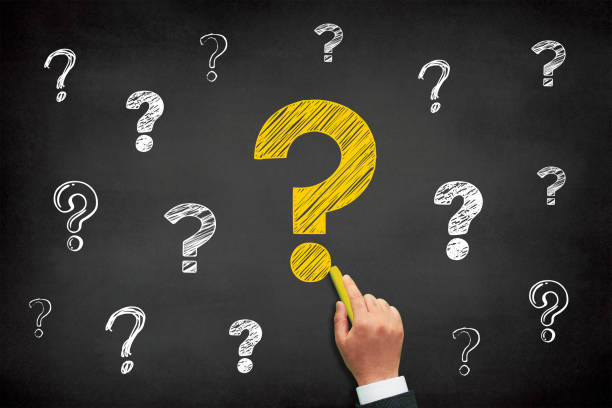istock Question mark design with a male hand writing on chalkboard 1426297310