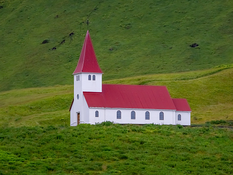 Reyniskirkja Church located on a hill overlooking the remote seafront village of VÃ­k Ã­ MÃ½rdal, Southern Iceland