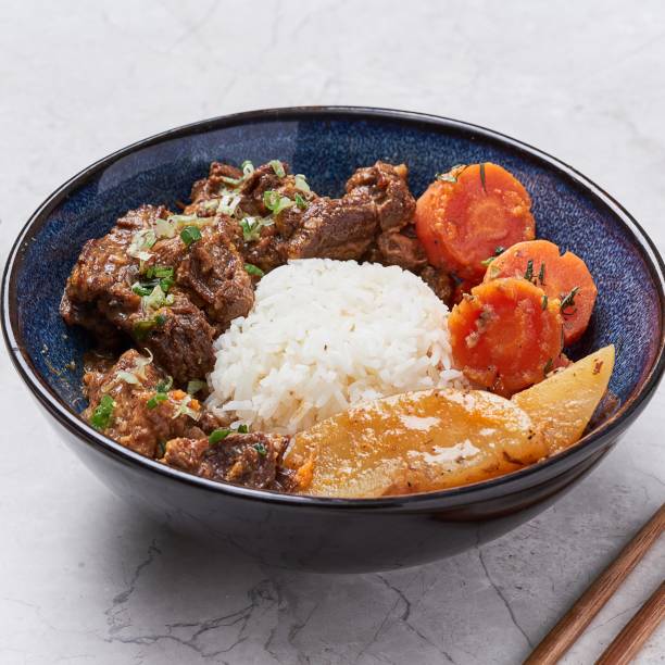 istock Beef Stew rice with carrot and potato served in a dish isolated on grey background side view of vietnam food 1426299584