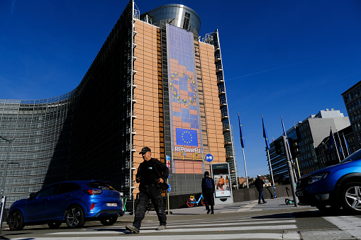 People walk outside of Berlaymont which is an office building which houses the headquarters of the EU Commission, the executive branch of the EU. Brussels, Belgium on Sept. 22, 2022.