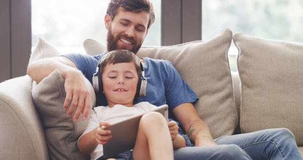 istock Digital tablet kid, father and technology for playing games, watching cartoons and internet development online at home. Happy boy child, dad and modern learning, fun apps and educational connection 1426303708