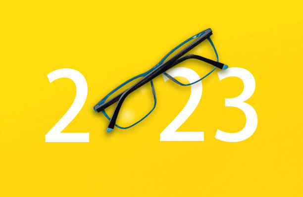 istock 2023 with glasses on yellow isolated background 1426303779