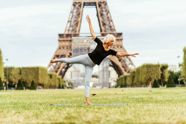 istock Mature woman practicing yoga in Paris 1426304132
