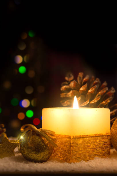 istock Christmas background with Advent candle and decoration on white snow. 1426304627