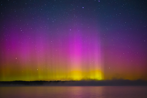 Northern lights - Aurora borealis over the lake