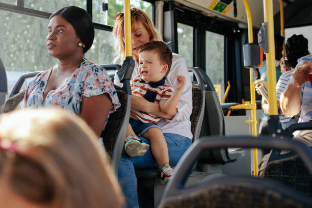 istock Mom and son on a city bus 1426308590