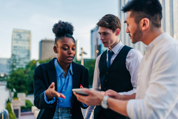 istock Young business team discussing strategy outdoors 1426308729
