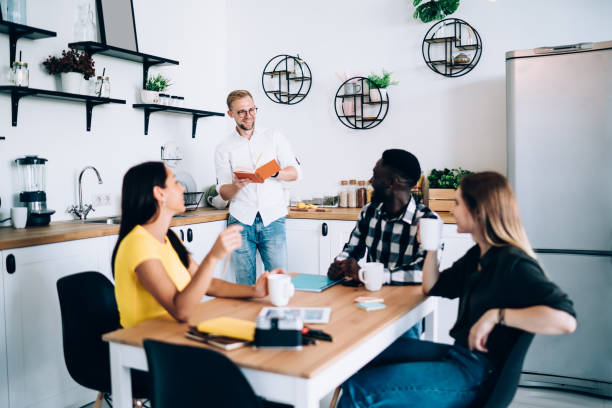 istock Happy diverse colleagues discussing business 1426310612