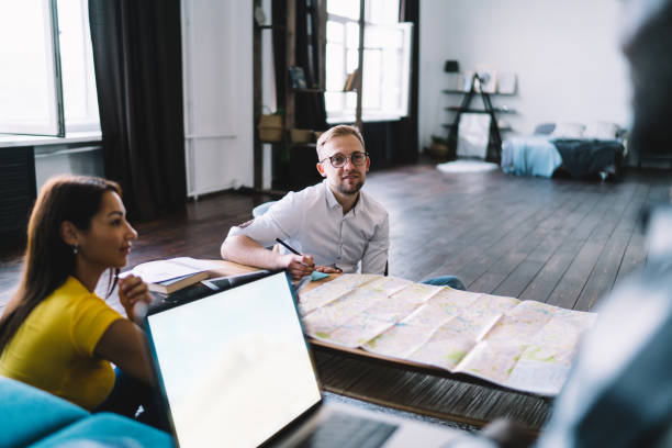 istock Happy diverse coworkers working on project in workplace 1426310631