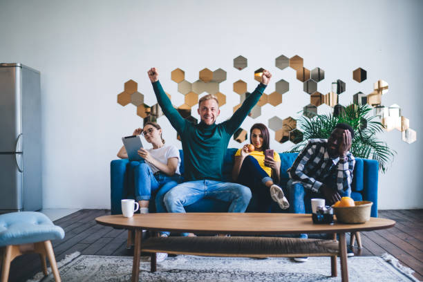 istock Group of diverse colleagues resting on couch at home 1426310717