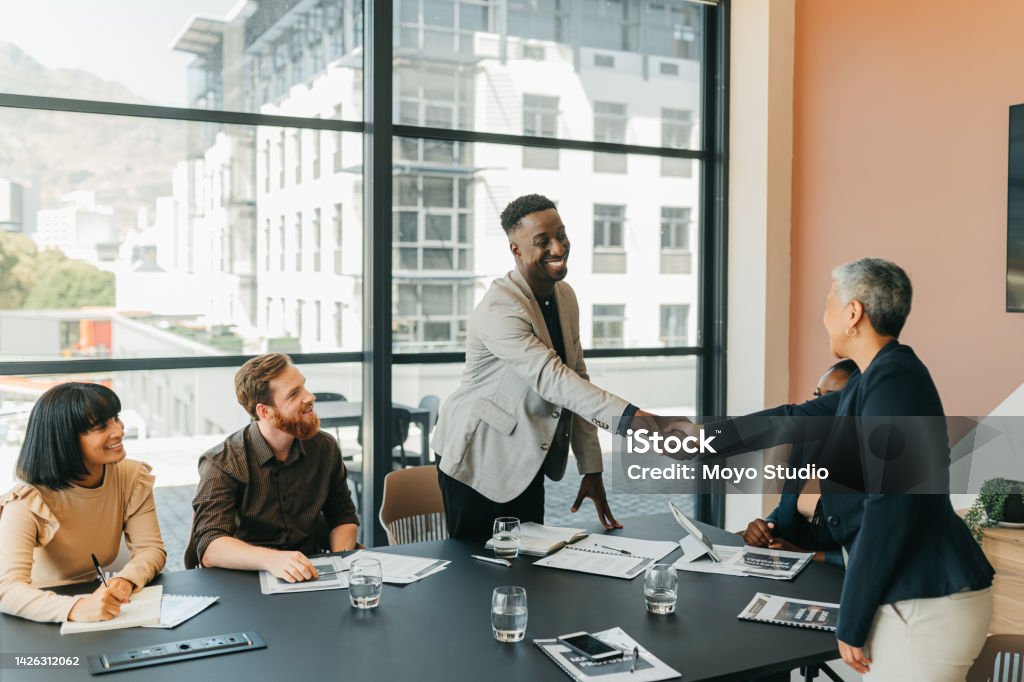 B2B partnership, collaboration or client handshake in business meeting for welcome, onboarding or thank you. Agency team shaking hands and happy with agreement, deal or negotiation strategy interview Customer Stock Photo