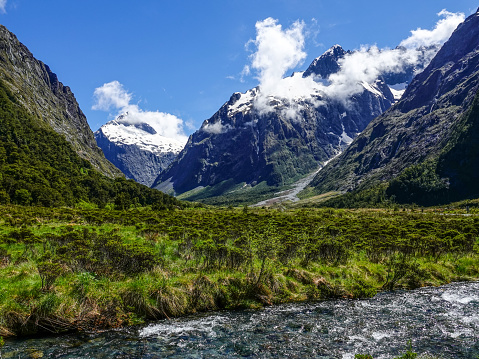 Snow capped peaks and hanging valleys along the road to Milford Sound, New Zealand.