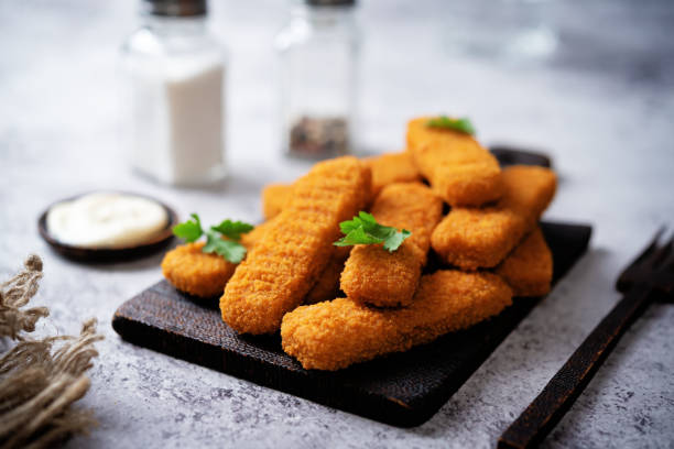 istock Fresh prepared fish sticks with sauce 1426324101