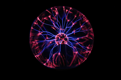 Closeup of a plasma globe in the darkness