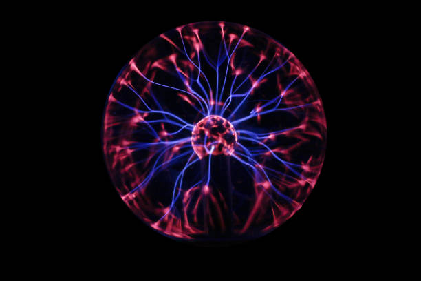 Closeup of a plasma globe in the darkness Closeup of a plasma globe in the darkness plasma ball stock pictures, royalty-free photos & images