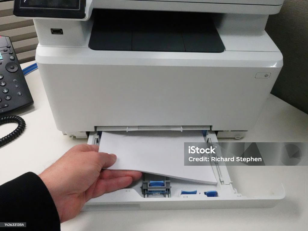 Paper Into Printer Man Loading Paper Into Office Printer Stock Photo - Download Image Now ...