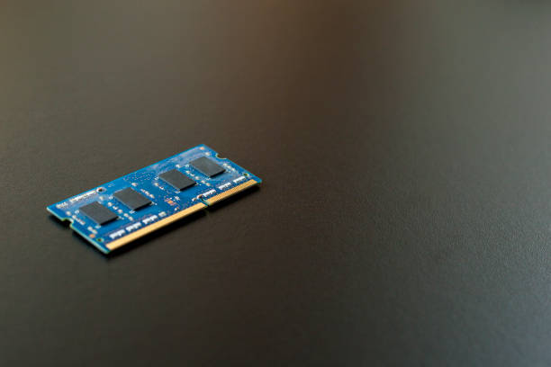 istock Computer memory chip placed on top of a black table. Connections and circuits on display 1426331931