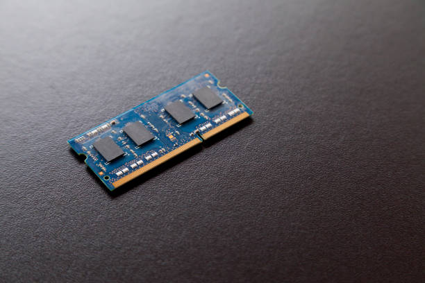 istock Computer memory chip placed on top of a black table. Connections and circuits on display 1426332117