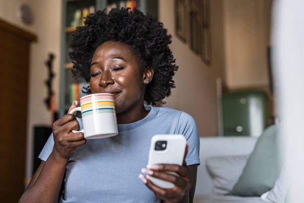 istock Woman smelling coffee 1426335274