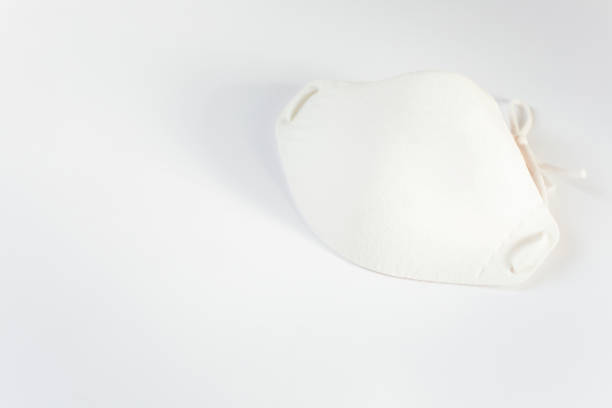 istock The white medical mask is on a white background. 1426335333