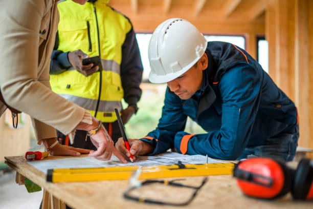 istock Client And Architect Editing Blueprints Of A Housing Project 1426335399