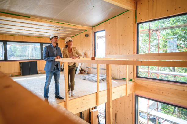 istock Building Contractor And Business Woman In Construction Site 1426335467