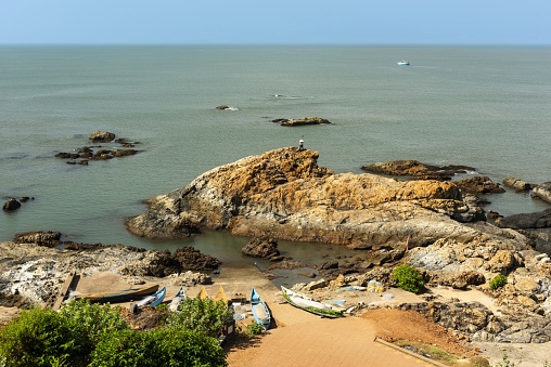 Goa, India, December 6, 2015: View of a small wharf near the beach Vagator in the Indian state of Goa on a sunny day. Goa is former Portugese colony.