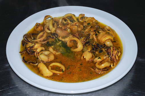 Squid with onions, traditional Spanish recipe.