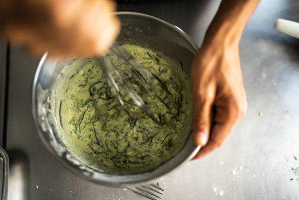 Female hands mixing ingredients in a mixing bowl