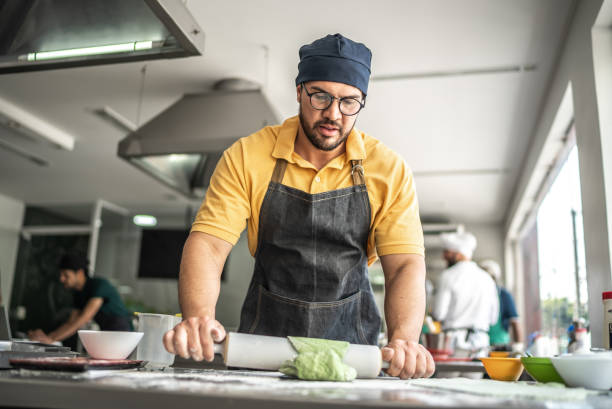 istock Chef preparing fresh pasta dough with a rolling pin 1426345160