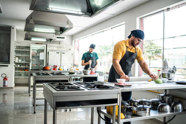 istock People working in a commercial kitchen 1426345405