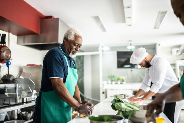 istock Senior man during cooking class or working in a restaurant 1426345664