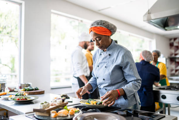 istock Senior woman preparing a dish in the kitchen 1426346078
