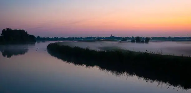 Photo of Low fog over the Dutch countryside during sunrise