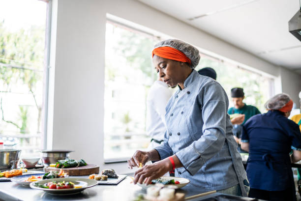 istock Senior woman preparing a dish in the kitchen 1426346650