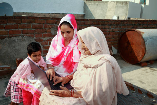 istock Indian family using laptop at home 1426347585