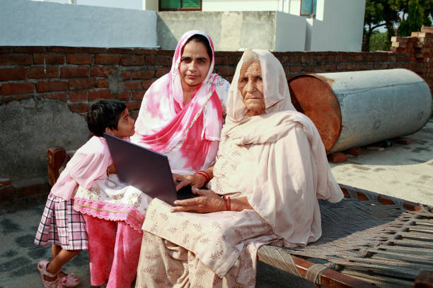istock Indian family using laptop at home 1426347600