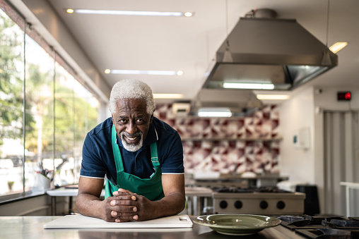 Portrait of a senior man in a commercial kitchen