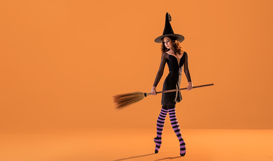 Cheerful witch pretending to sit on a broomhttp://www.twodozendesign.info/i/1.png