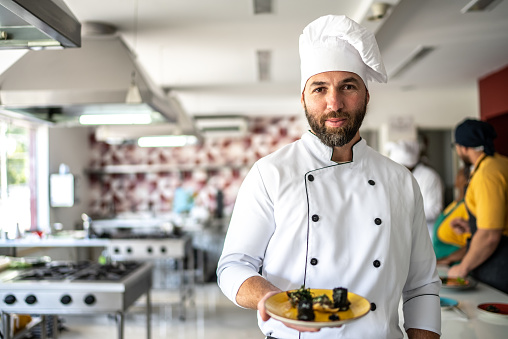 Chef showing a meal he'd prepared