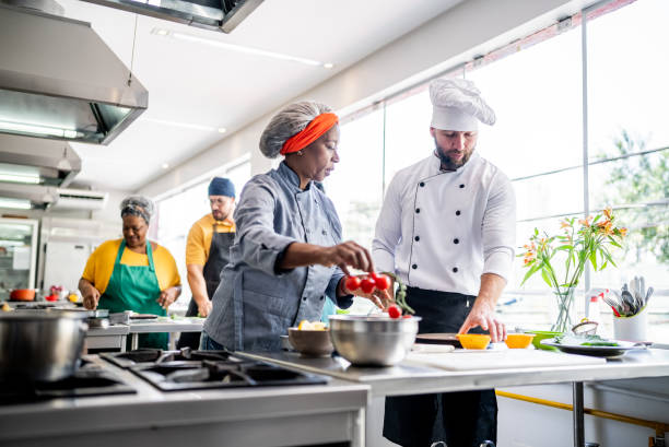 istock Colleagues cooking in the kitchen 1426350220