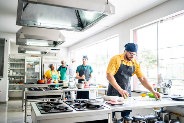 istock Mid adult man making pasta in the kitchen 1426350301