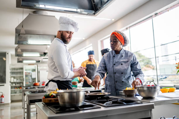 istock Colleagues cooking in the kitchen 1426350313