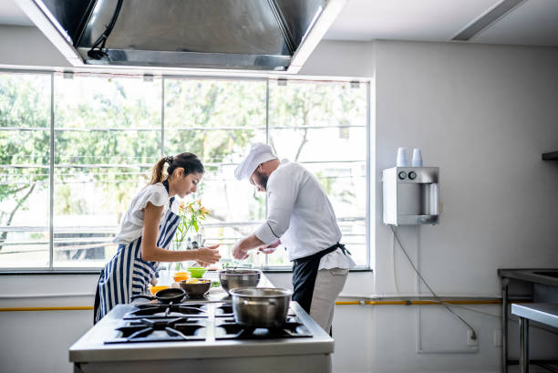 istock Colleagues cooking in the kitchen 1426350434