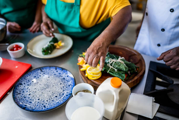 Hands emplating a dish in the kitchen