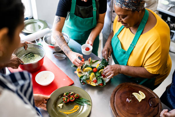 istock Colleagues emplating a dish in a cooking class 1426350944