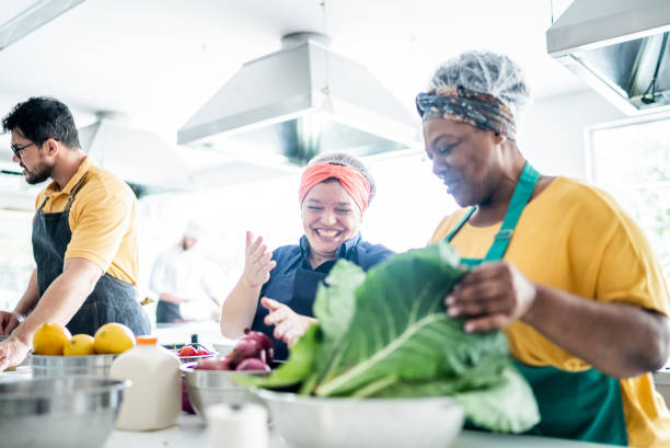 istock Coworkers cooking together in a commercial kitchen 1426352393