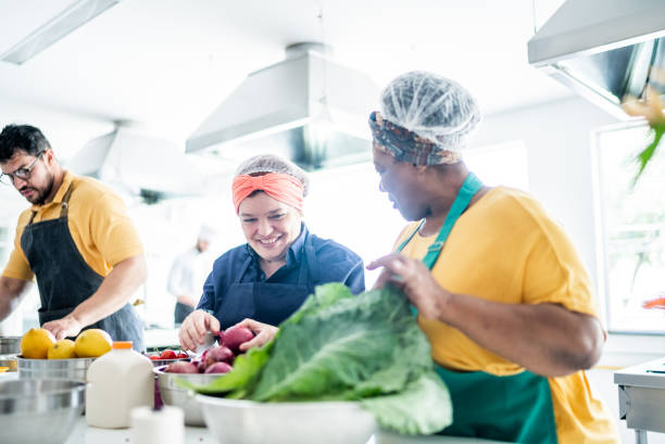 istock Coworkers cooking together in a commercial kitchen 1426352543
